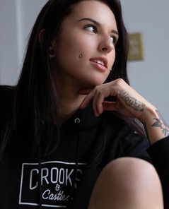 Tattooed Brunette Octavia May In Black Hoodie Teasing By The Window