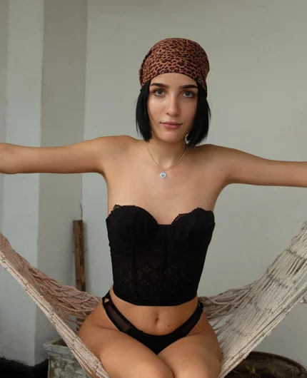 Soft Indoor Hammock Scene With Brunette Queti Revello In Black Corset Outfit Pose