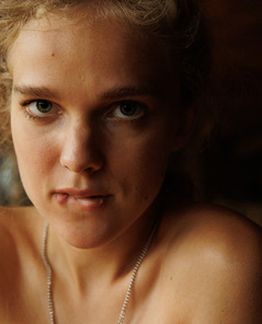 Xena Khrabry Teasing In A Cozy Cafe Wearing Glasses And Denim